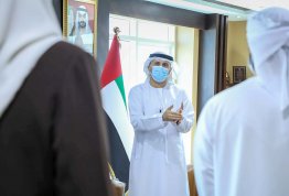 Engineering students gift a copy of Al Khaleej newspaper to the Chancellor